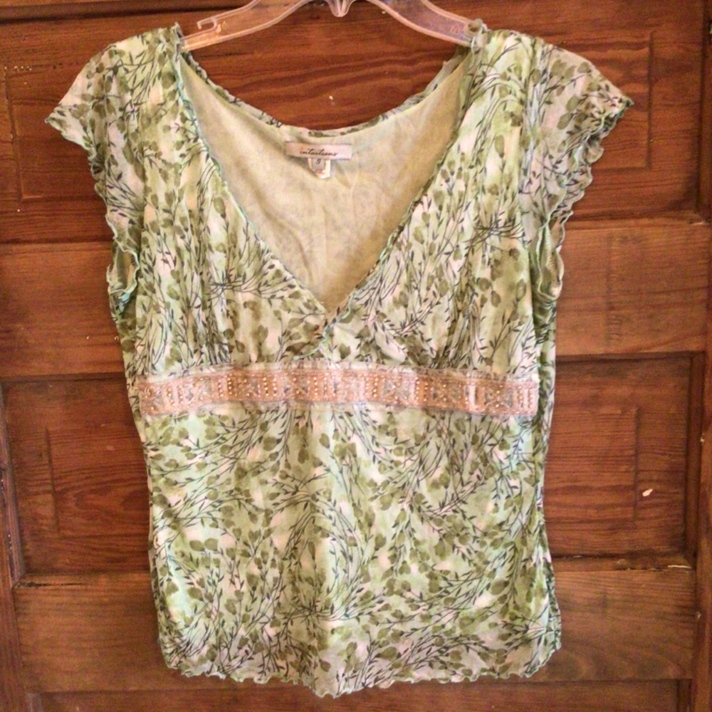 Feminine, stretchy, soft top.